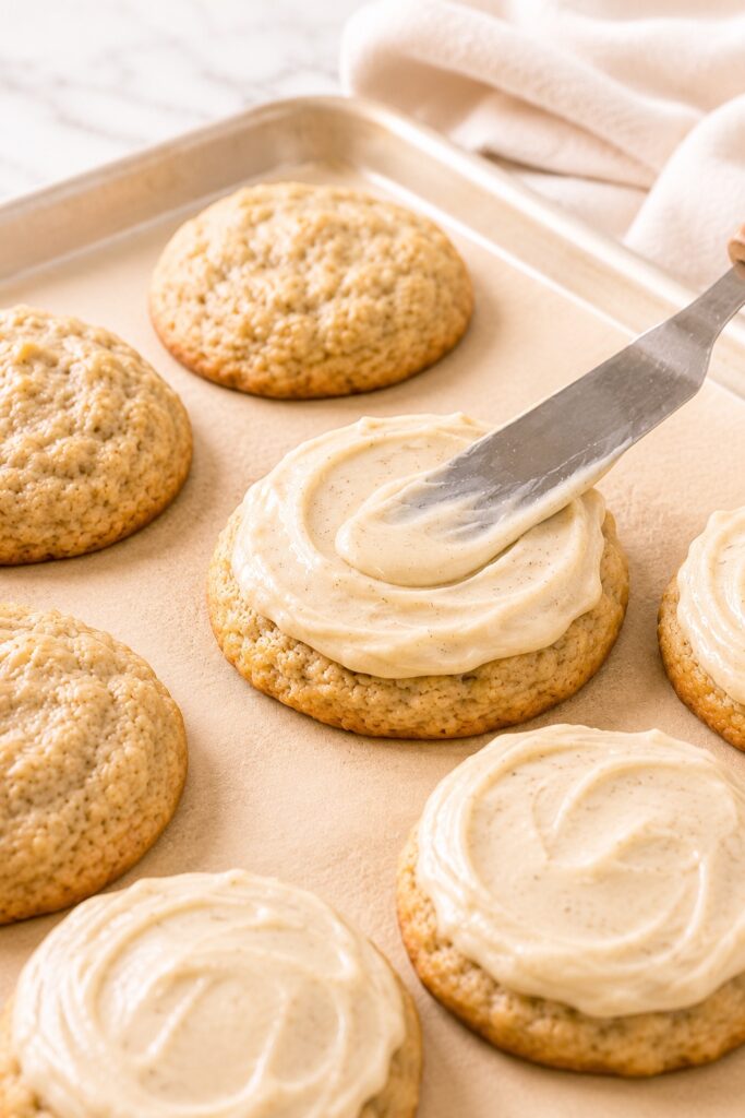 Spreading Frosting on Banana Cookies