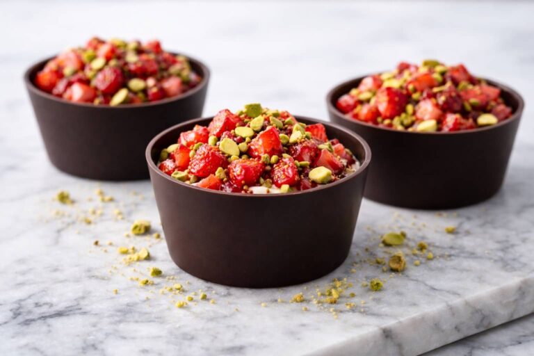 Dubai chocolate strawberry cups with dark chocolate shells and strawberry pistachio filling