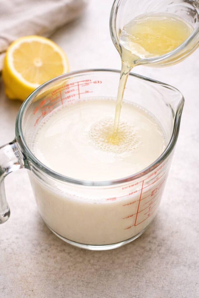 Adding lemon juice to milk to make buttermilk