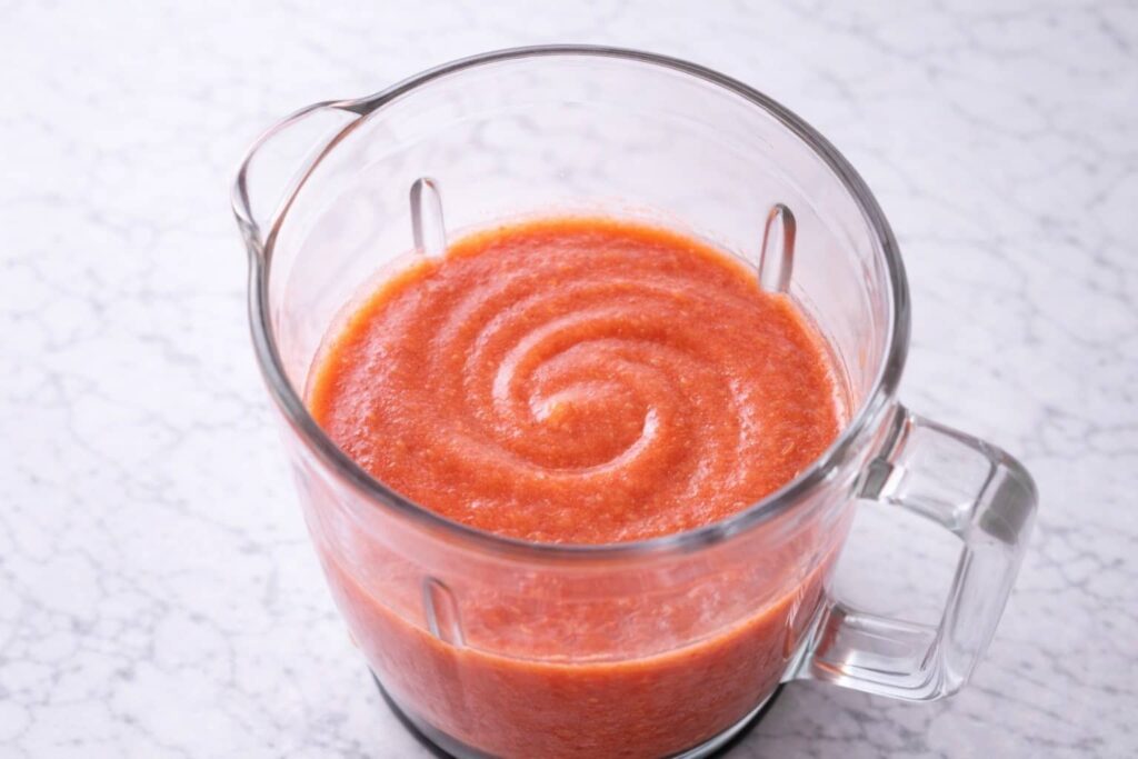 Smooth Fruit Puree for Fruit Roll Ups smooth fruit puree in blender for homemade fruit roll ups with no visible chunks