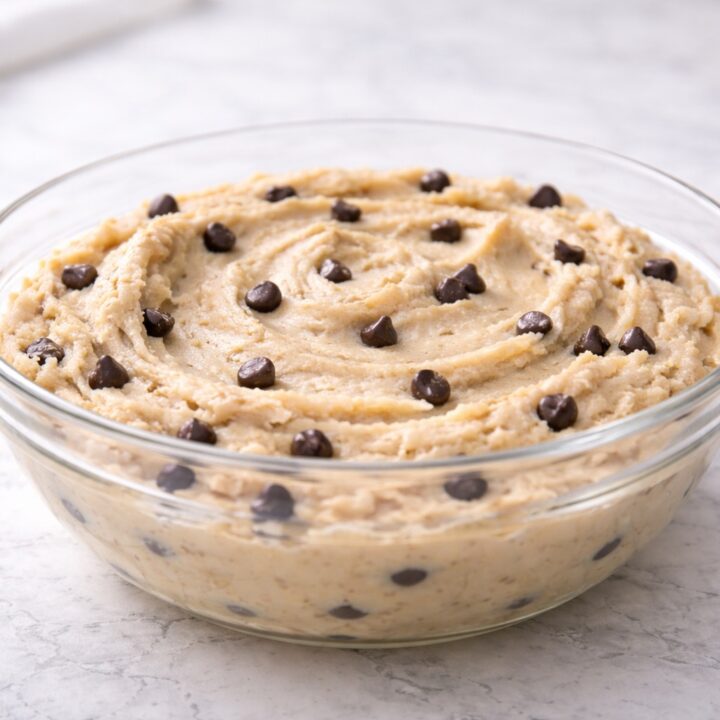 edible cookie dough recipe in glass bowl with creamy texture and chocolate chips
