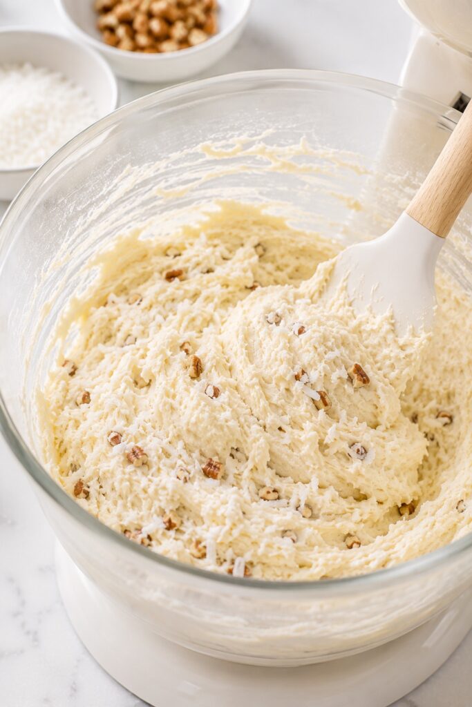 Folding coconut and pecans in Italian Cream Cake batter
