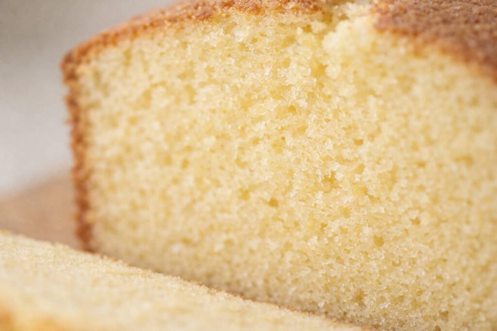 Close up of pound cake crumb showing a dense yet tender buttery texture