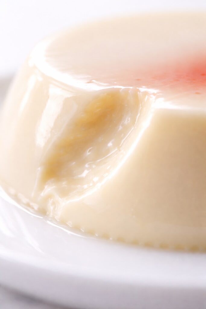 Panna Cotta Silky Texture Close-Up Extreme close-up of panna cotta showing silky smooth creamy texture