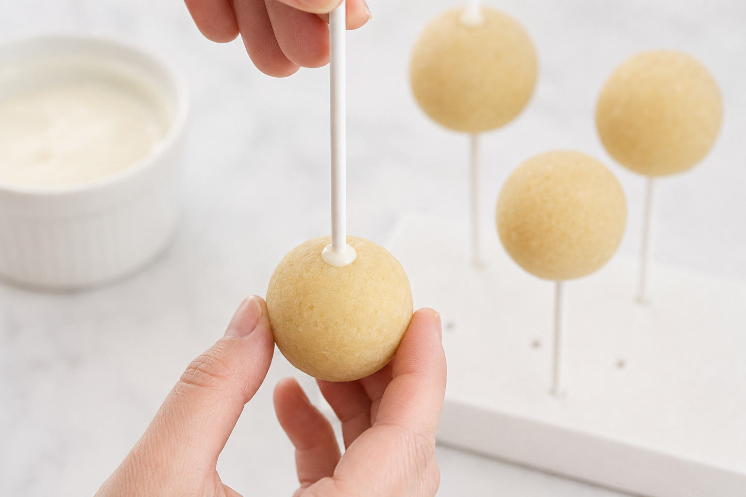 Cake pop stick dipped in coating and inserted straight into a chilled cake ball