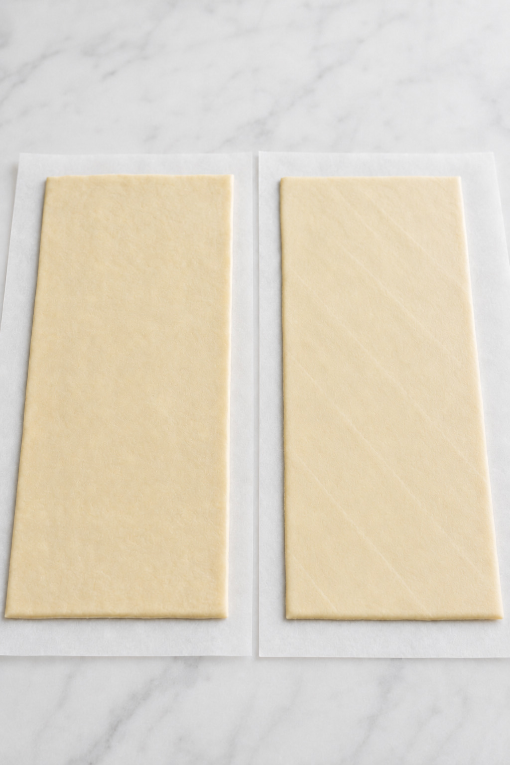 Seamless crescent dough beside perforated crescent dough with the seams pinched completely closed.